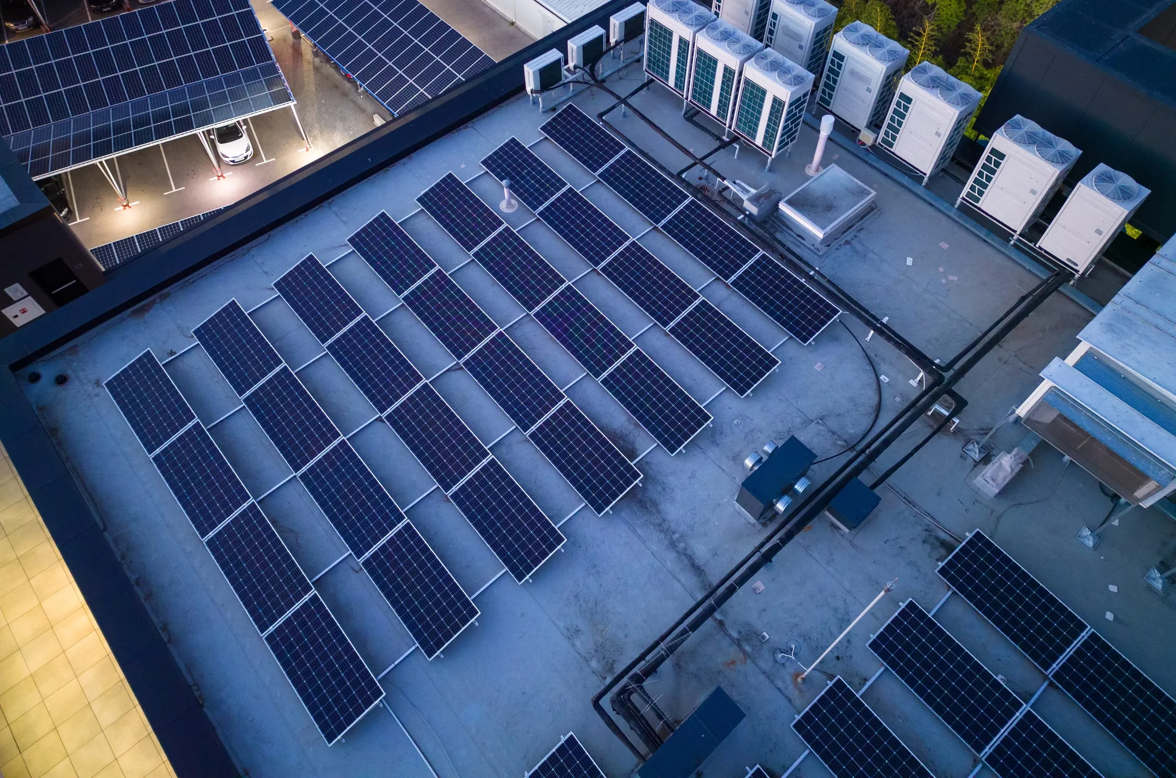 Aerial view of solar panels and HVAC on a building