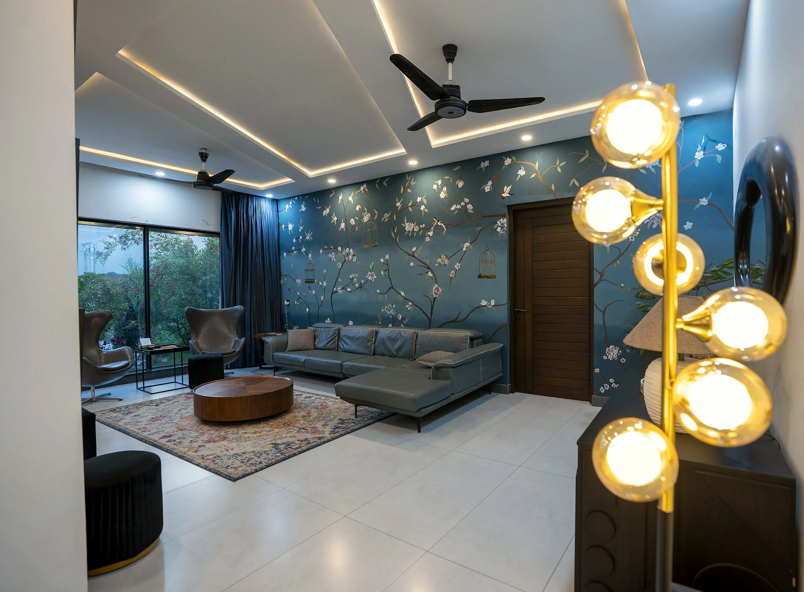 Living room with mural and motorised curtains in the Ultra Edge Experience Studio