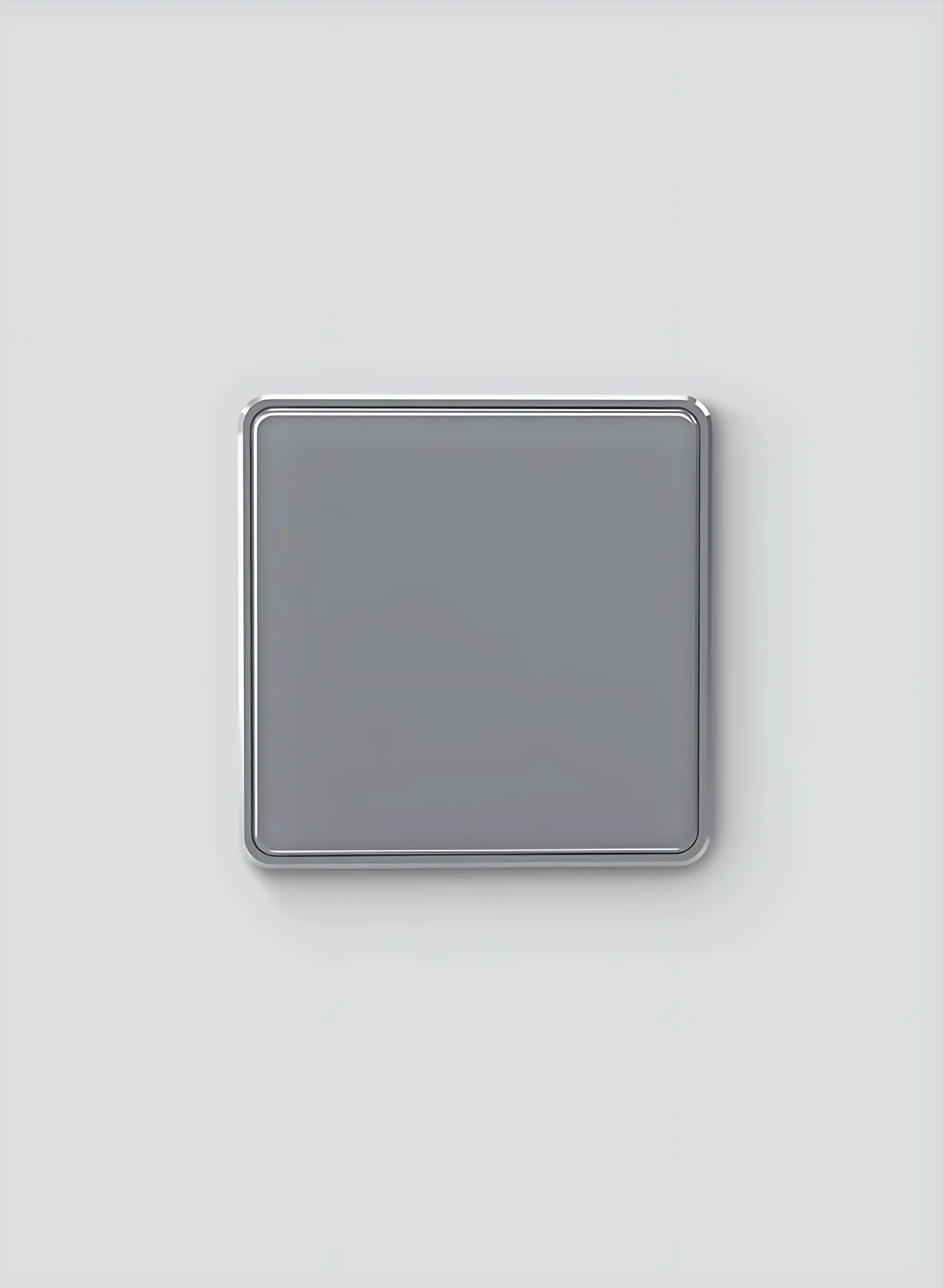 Grey square glass smart switch on a grey studio wall