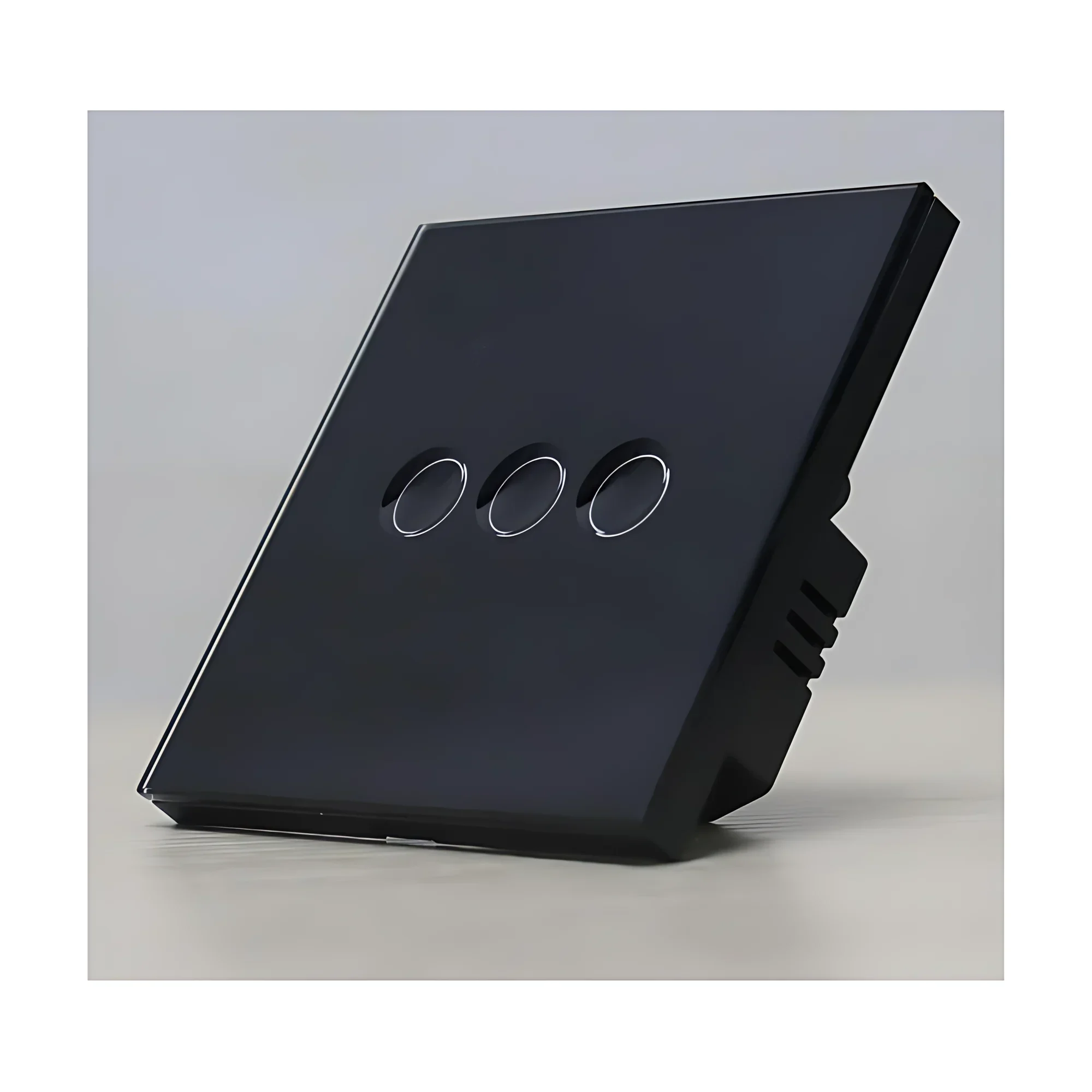 Black glass 3-gang smart switch with framed edge, angled view