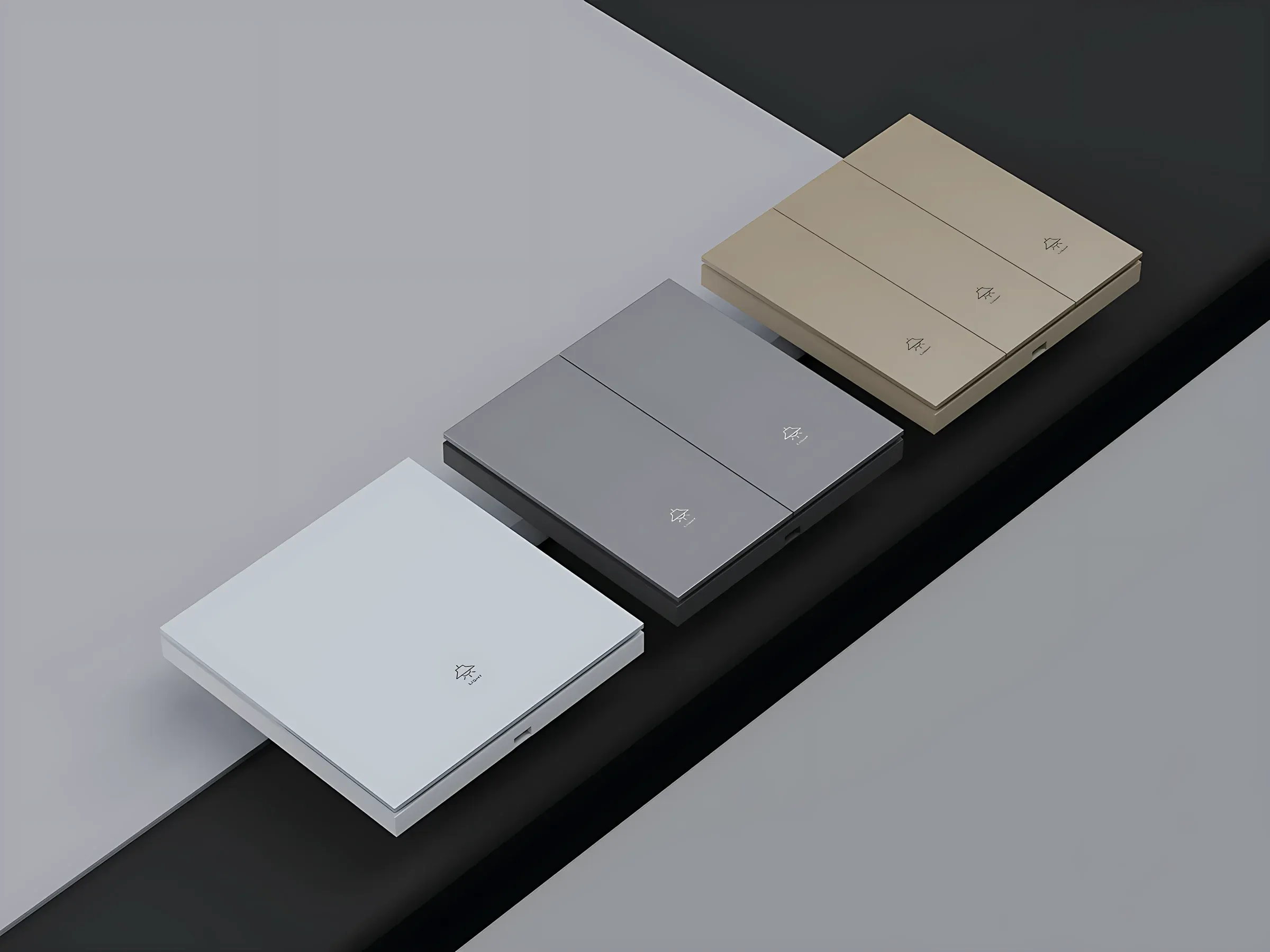 White, grey and champagne push-button switches on stepped plinths