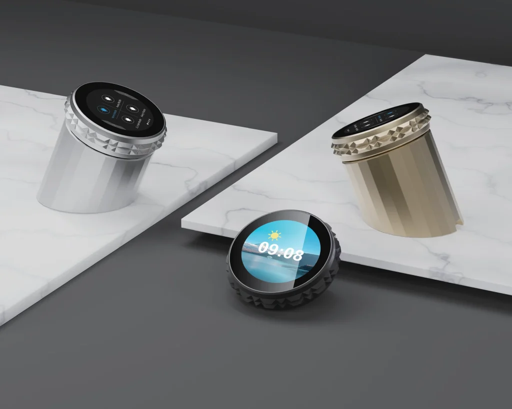 Round desktop smart controllers in silver and gold on marble